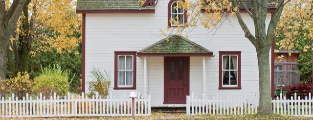 house with white picket fence