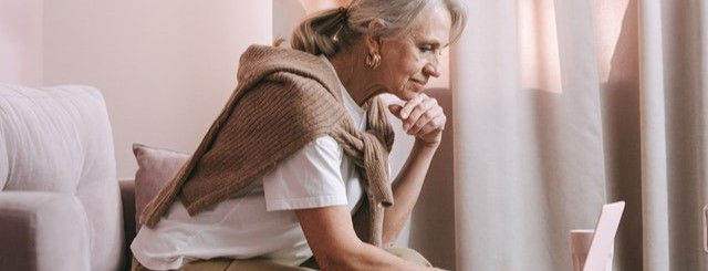 woman looking at laptop