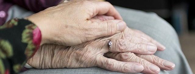 husband and wife holding hands