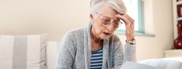 elderly woman concerned about nursing home bill