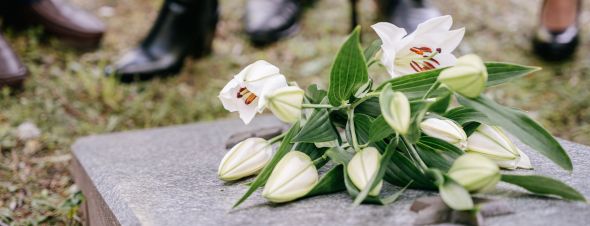 flowers on grave stone