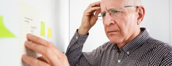 man looking at list confused