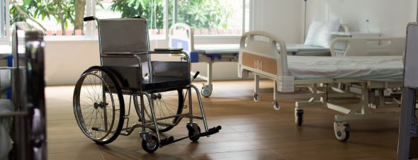 nursing home rooms with beds and wheelchair